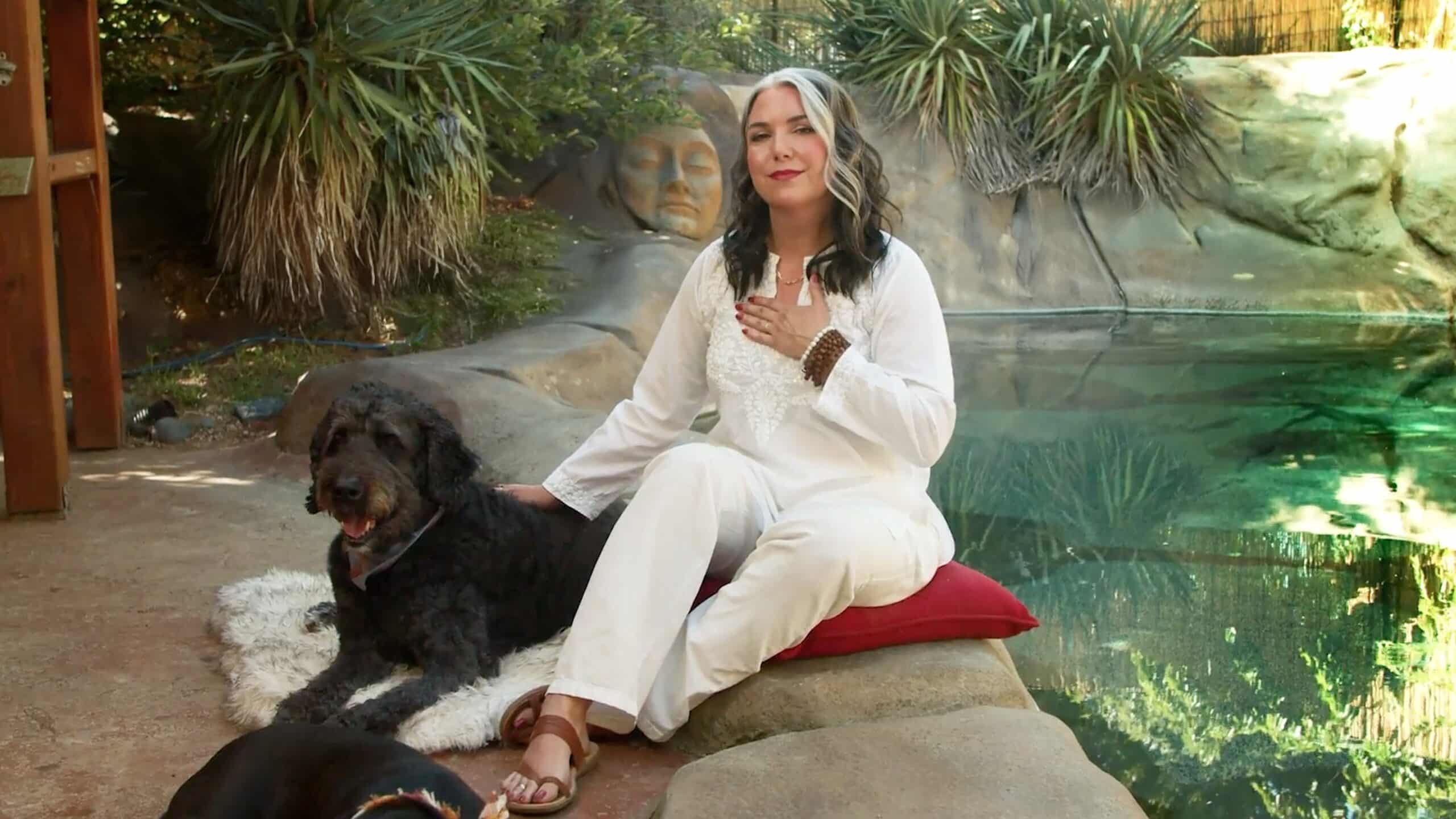 Amanda Ree sitting with her dog during meditation moments, a show on DOGTV